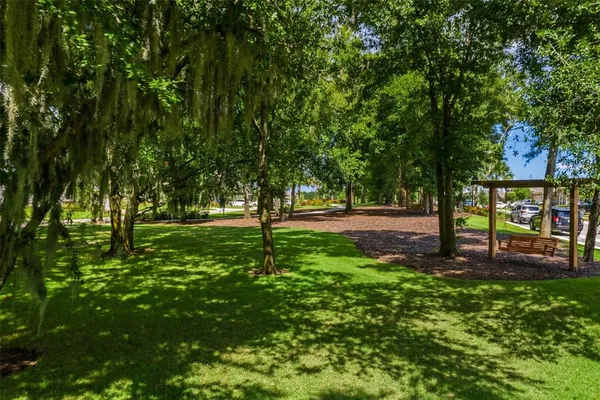 a sign that is sitting on a brick wall