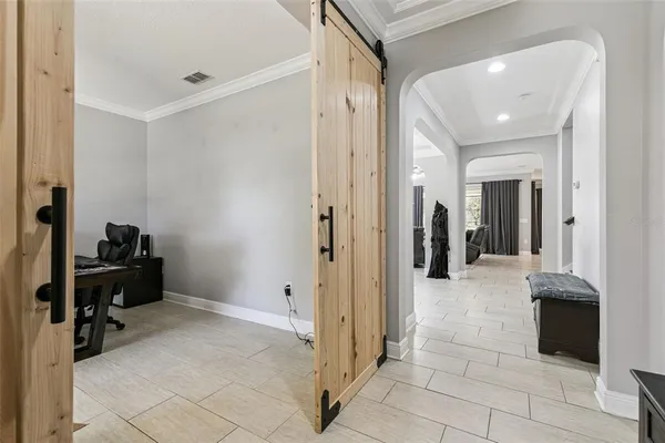 a view of a livingroom with fireplace and furniture