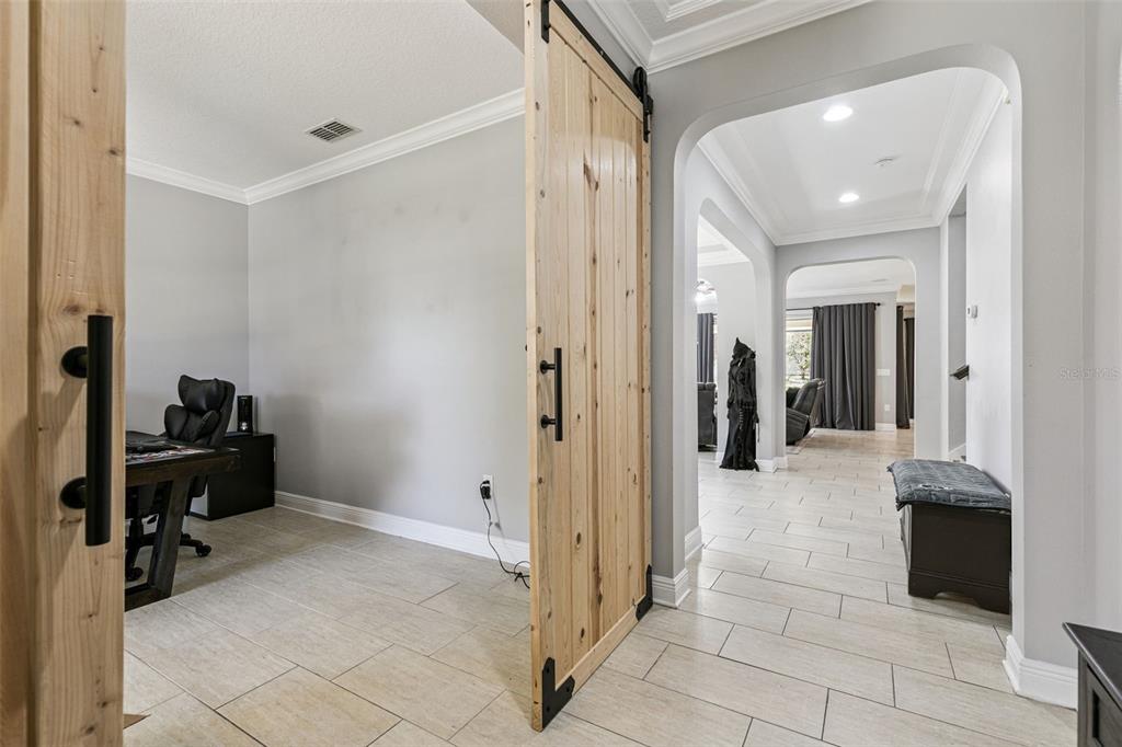 2541 Red Berry Way Ocoee, FL 34761 - Photo 44 of 49 a view of a hallway with closet and a fireplace