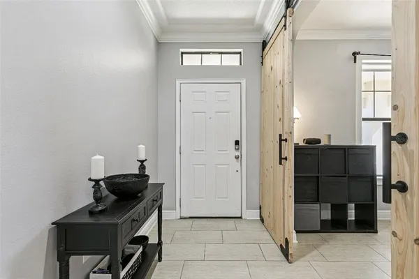 a kitchen with a refrigerator and a stove top oven