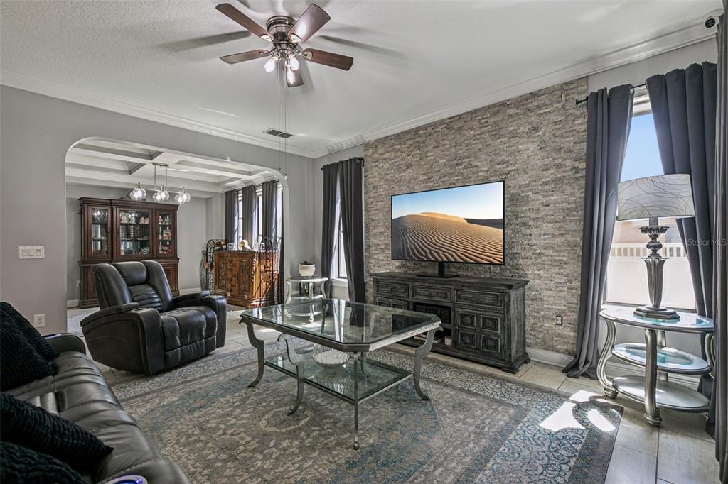 2541 Red Berry Way Ocoee, FL 34761 - Photo 9 of 49 a living room with furniture and a flat screen tv