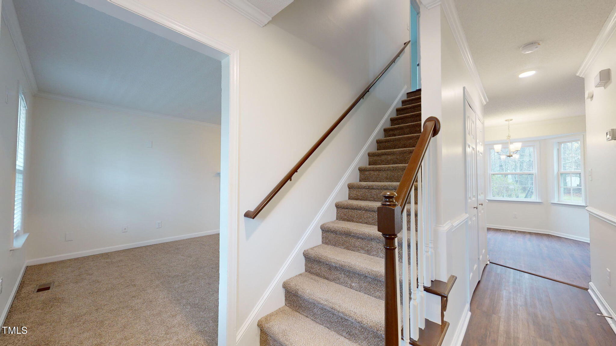 4805 Topstone Road Raleigh, NC 27603 - Photo 26 of 43 a view of staircase with white walls and windows