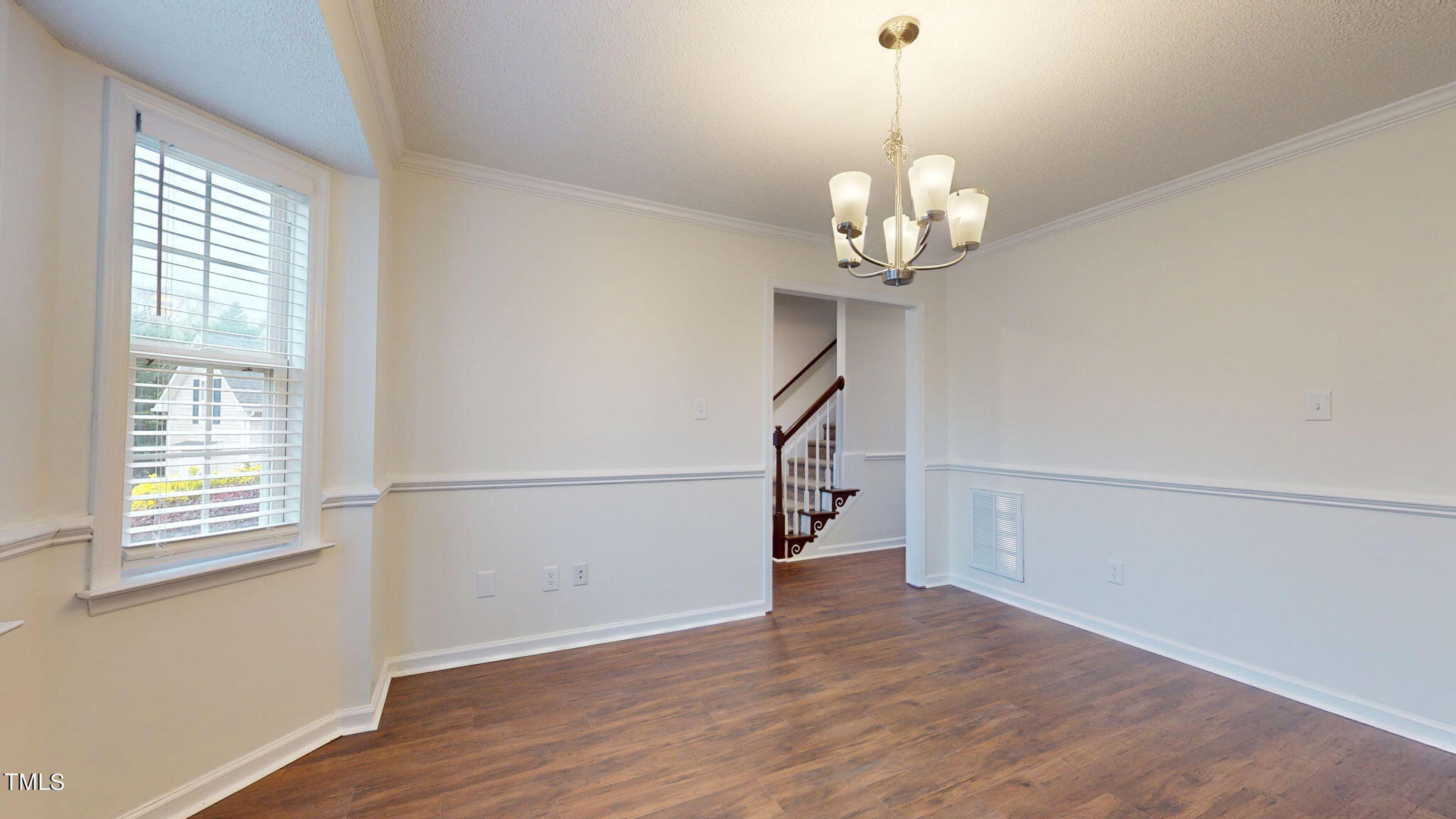 4805 Topstone Road Raleigh, NC 27603 - Photo 3 of 43 a view of a chandelier in a room with a window