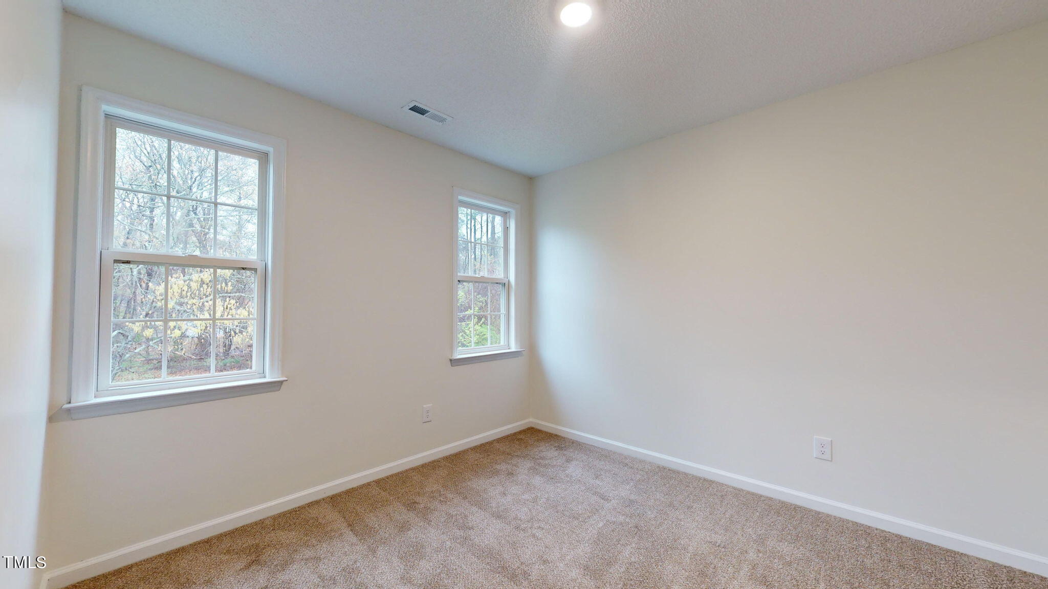 4805 Topstone Road Raleigh, NC 27603 - Photo 40 of 43 an empty room with windows