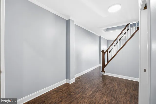 a view of entryway with wooden floor