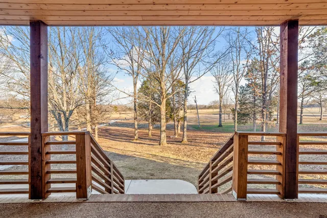 a view of swimming pool with outdoor seating