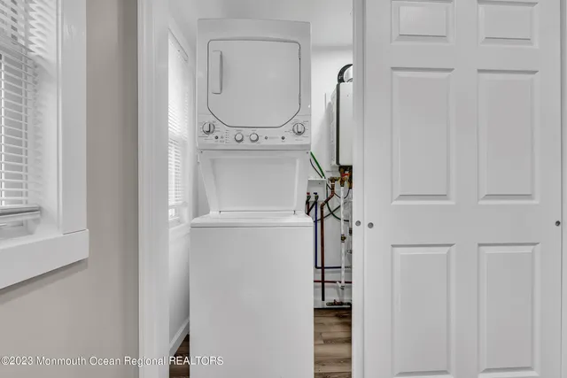 a close view of a utility room with dryer and washer