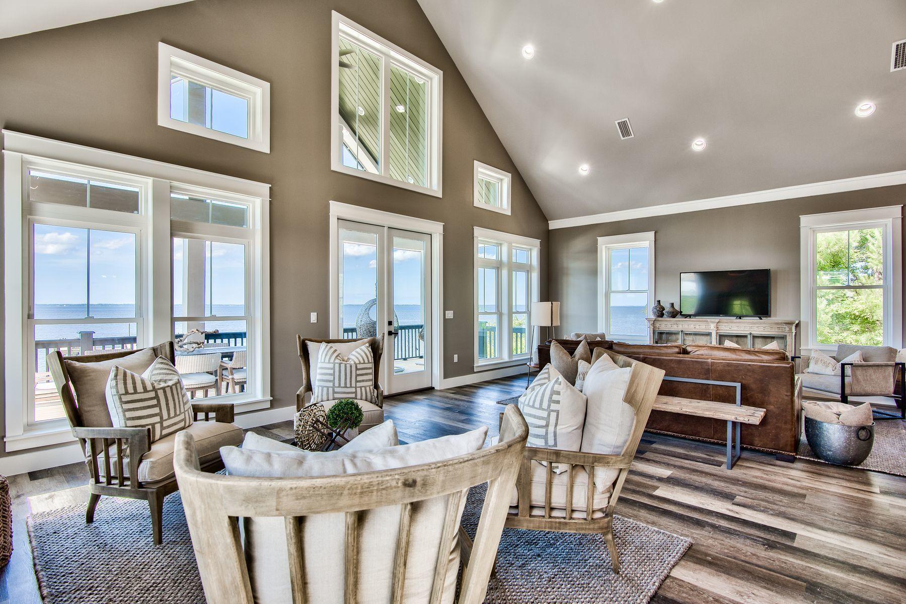 474 Beatrice Point Road Freeport, FL 32439 - Photo 11 of 69 a living room with furniture fireplace and a flat screen tv