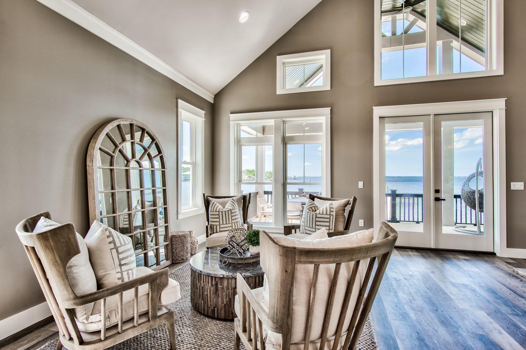 474 Beatrice Point Road Freeport, FL 32439 - Photo 12 of 69 a living room with furniture and a large window