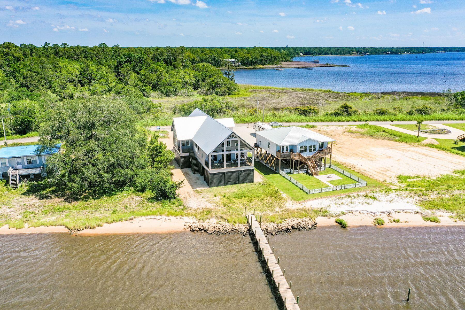 474 Beatrice Point Road Freeport, FL 32439 - Photo 17 of 69 an aerial view of a house with a garden and lake view