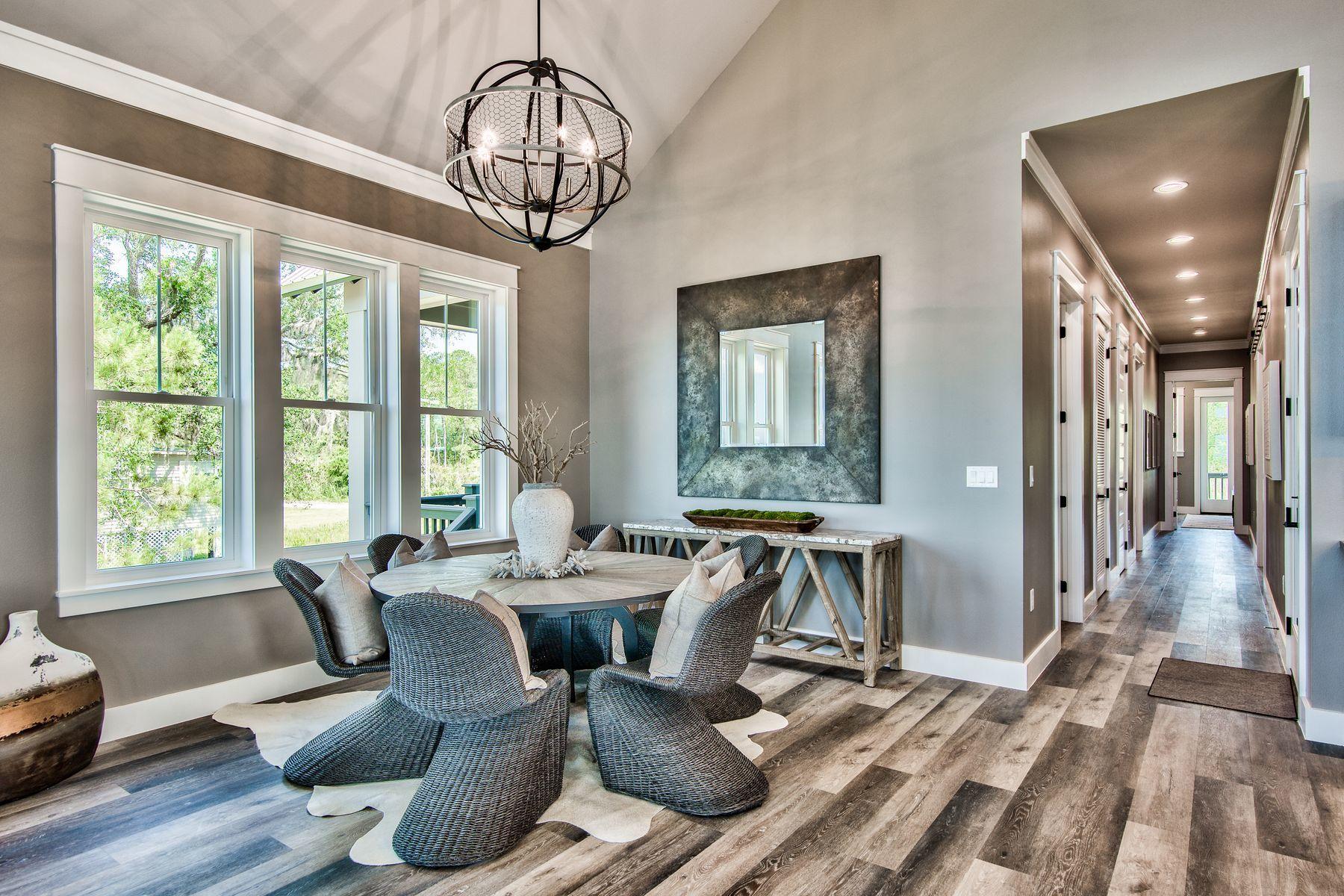 474 Beatrice Point Road Freeport, FL 32439 - Photo 21 of 69 a view of a dining room with furniture window and wooden floor