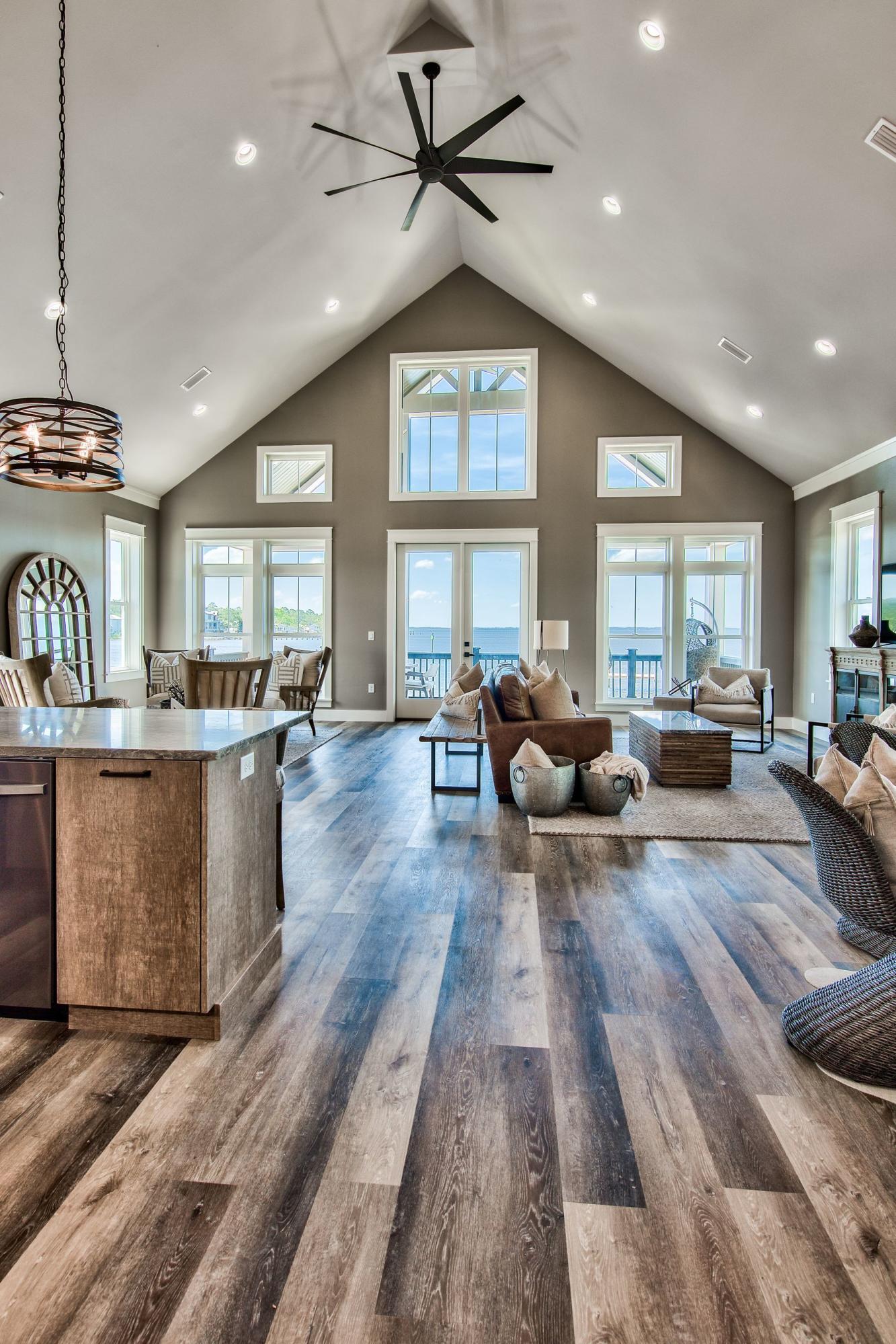 474 Beatrice Point Road Freeport, FL 32439 - Photo 3 of 69 a living room with furniture kitchen view and a large window