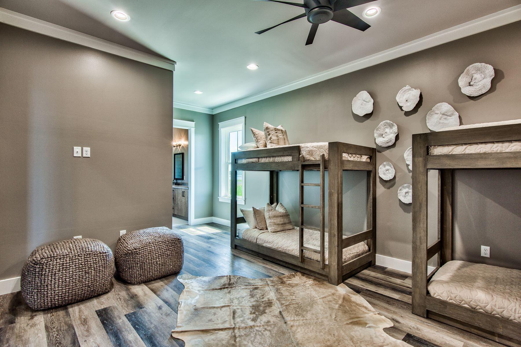 474 Beatrice Point Road Freeport, FL 32439 - Photo 32 of 69 a bedroom with a bed and a ceiling fan