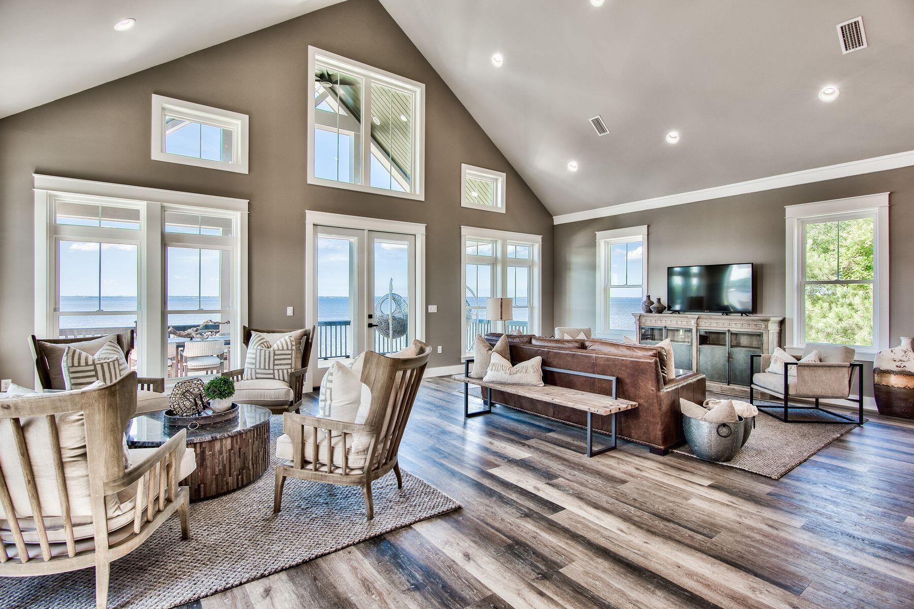474 Beatrice Point Road Freeport, FL 32439 - Photo 4 of 69 a living room with furniture or couch and a wooden floor