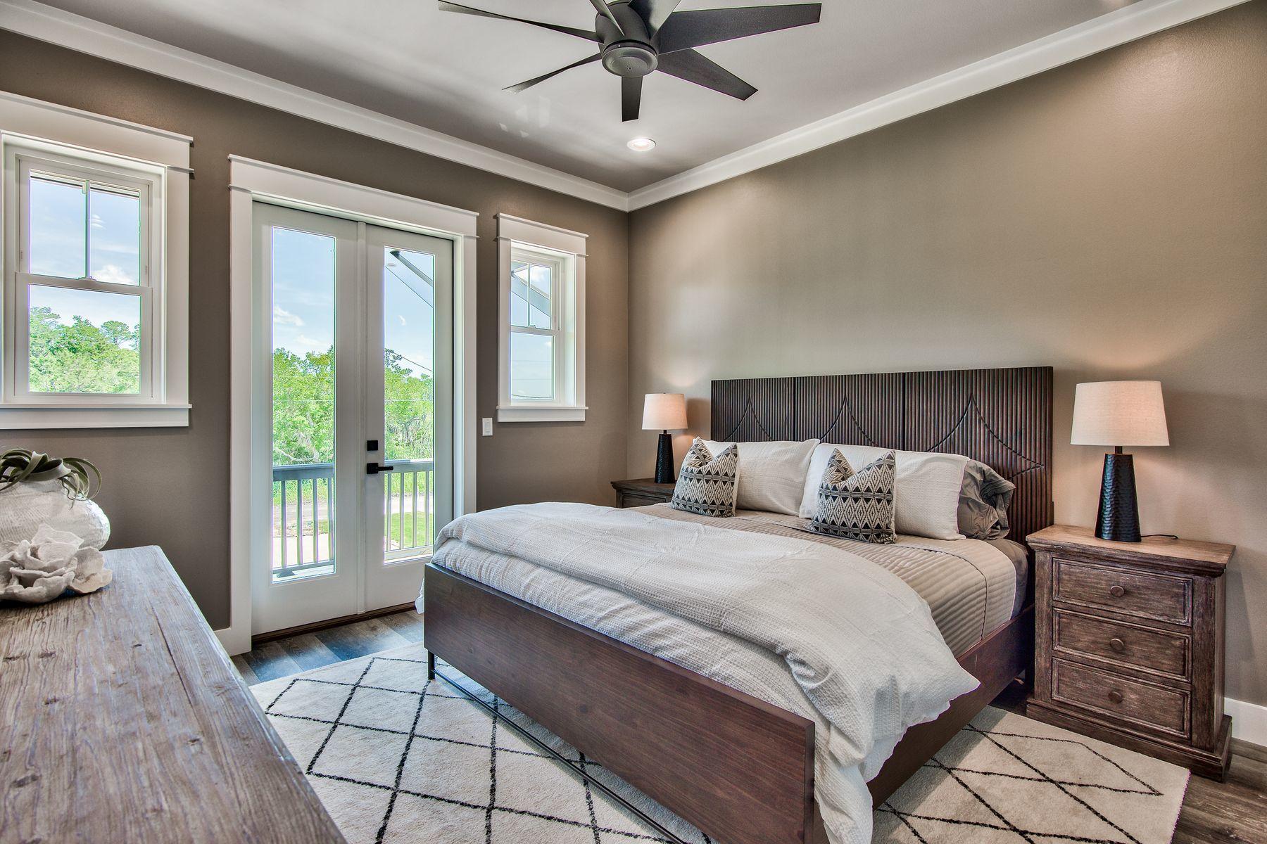 474 Beatrice Point Road Freeport, FL 32439 - Photo 42 of 69 a bedroom with a large bed and a window