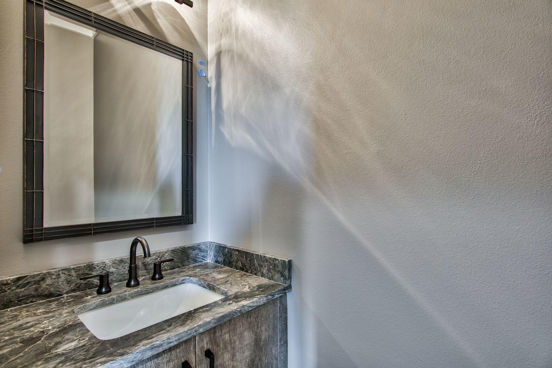 474 Beatrice Point Road Freeport, FL 32439 - Photo 45 of 69 a bathroom with a granite countertop sink and a mirror