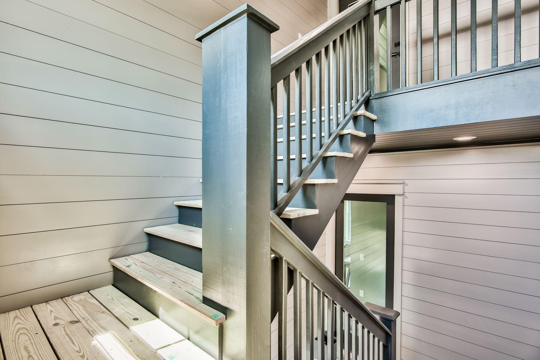 474 Beatrice Point Road Freeport, FL 32439 - Photo 51 of 69 a view of entryway with wooden floor and stairs