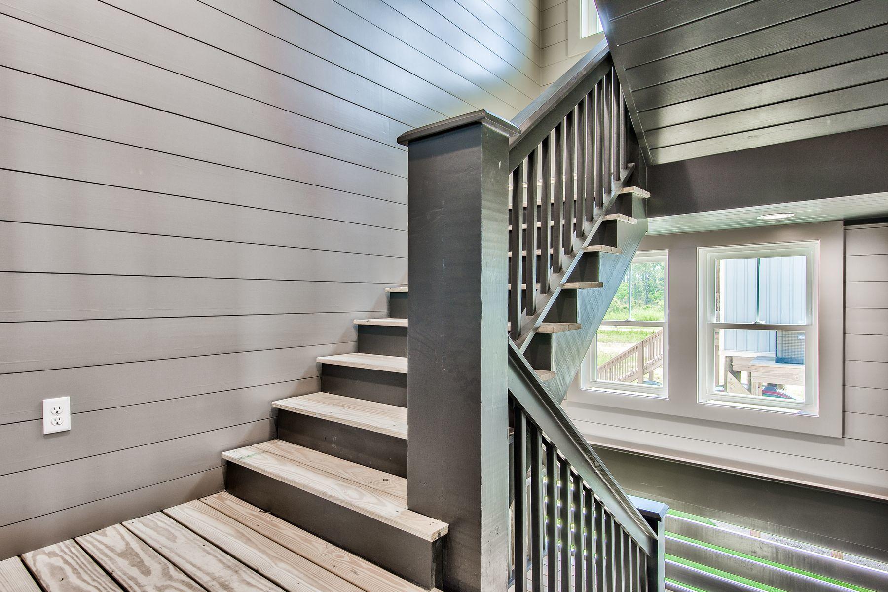 474 Beatrice Point Road Freeport, FL 32439 - Photo 53 of 69 a view of entryway with wooden floor and stairs