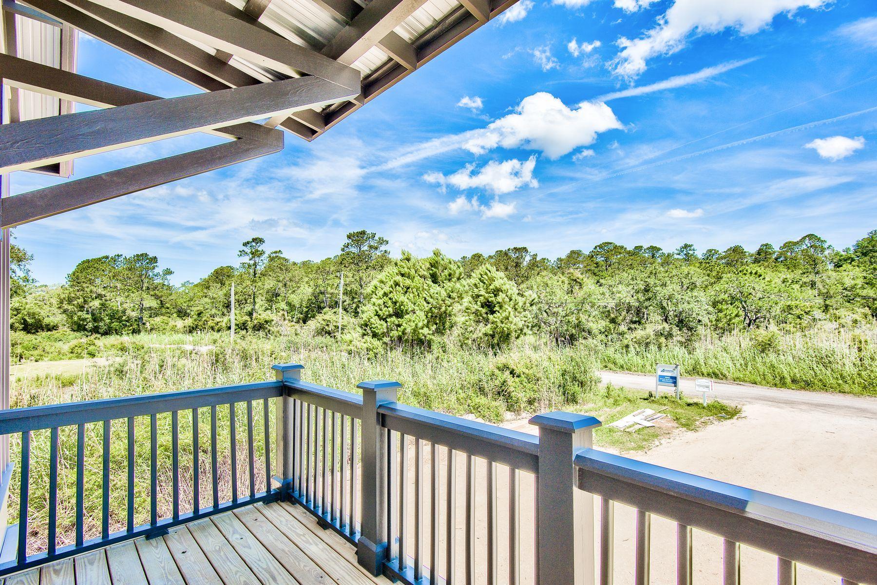 474 Beatrice Point Road Freeport, FL 32439 - Photo 55 of 69 a view of a balcony with wooden floor