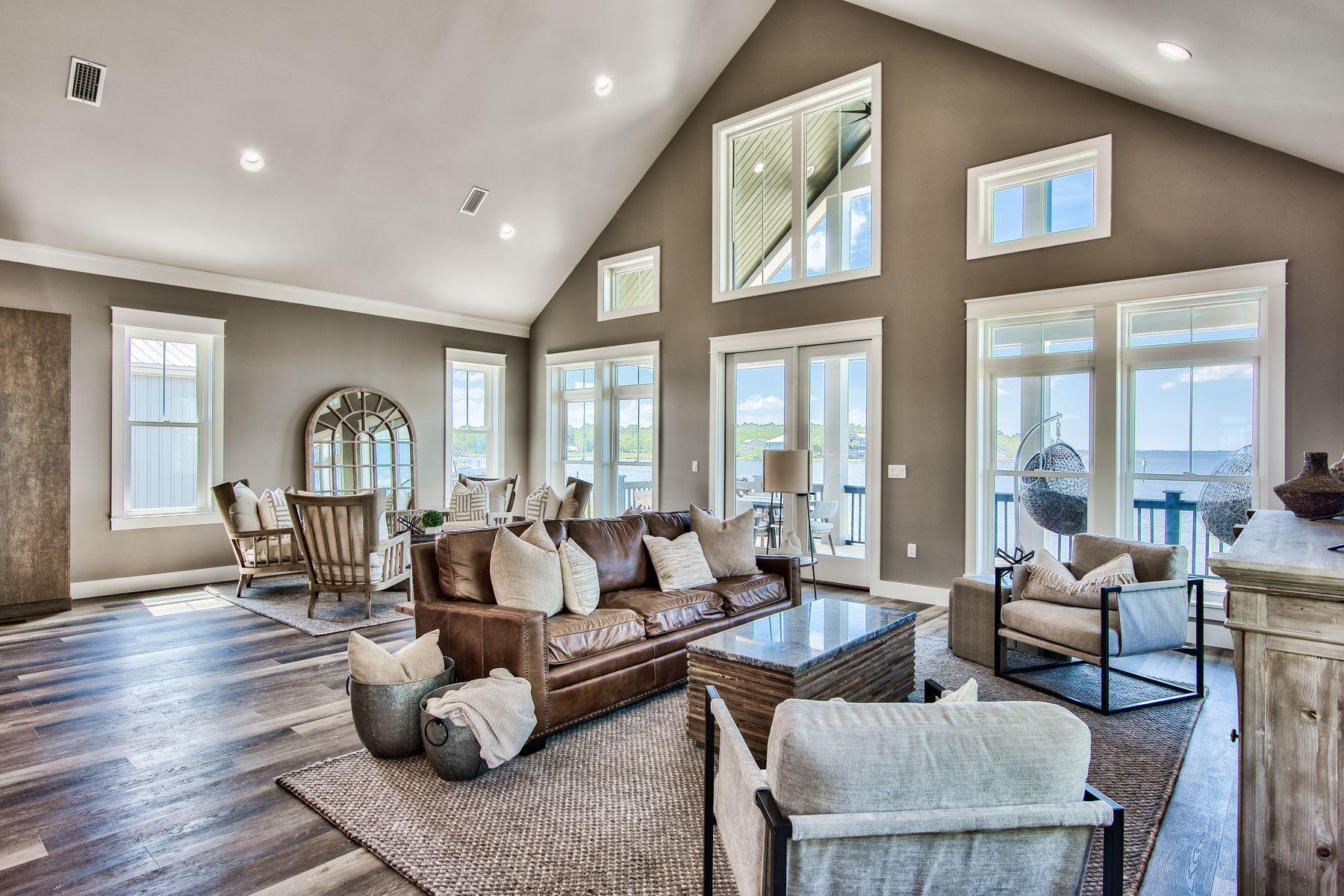 474 Beatrice Point Road Freeport, FL 32439 - Photo 6 of 69 a living room with furniture fireplace and a large window