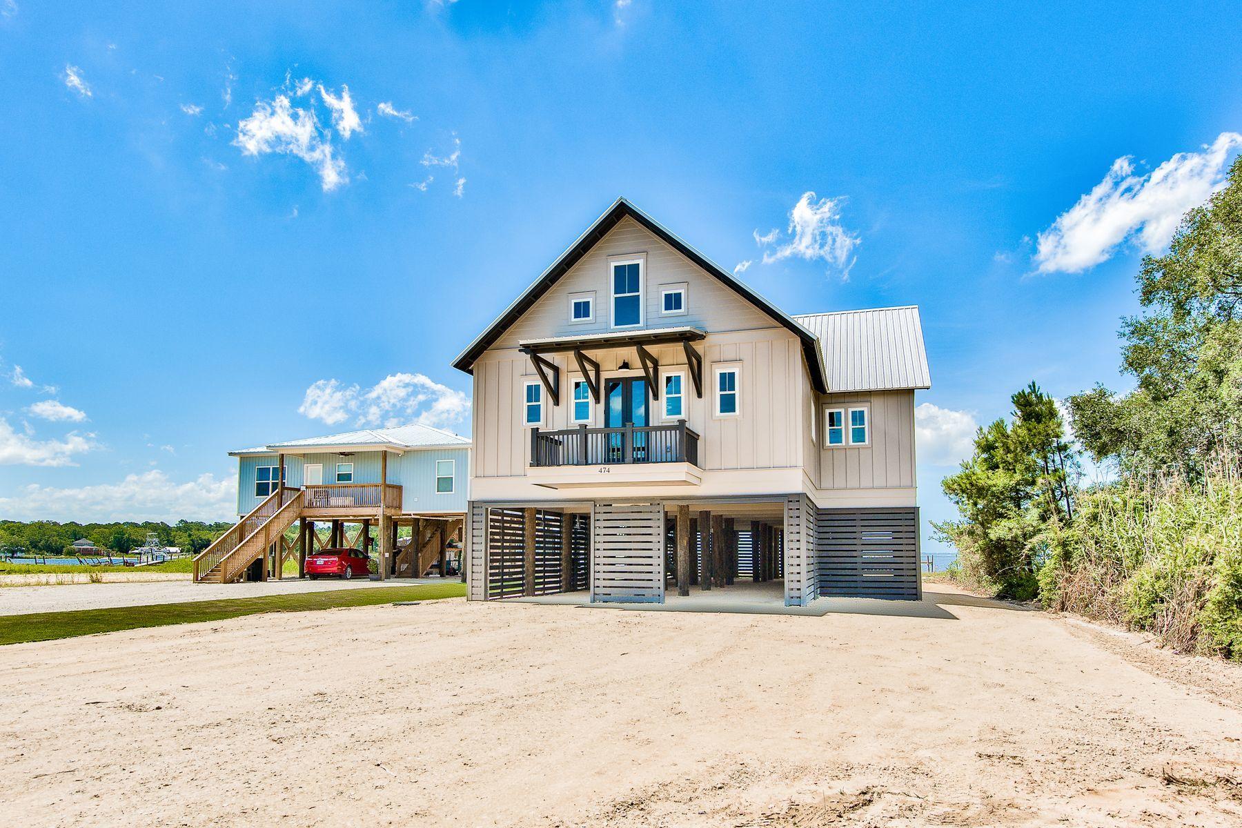 474 Beatrice Point Road Freeport, FL 32439 - Photo 69 of 69 a front view of a house with a yard and potted plants