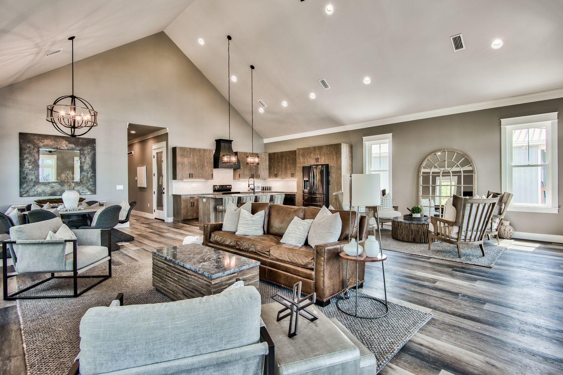 474 Beatrice Point Road Freeport, FL 32439 - Photo 9 of 69 a living room with furniture kitchen view and a chandelier