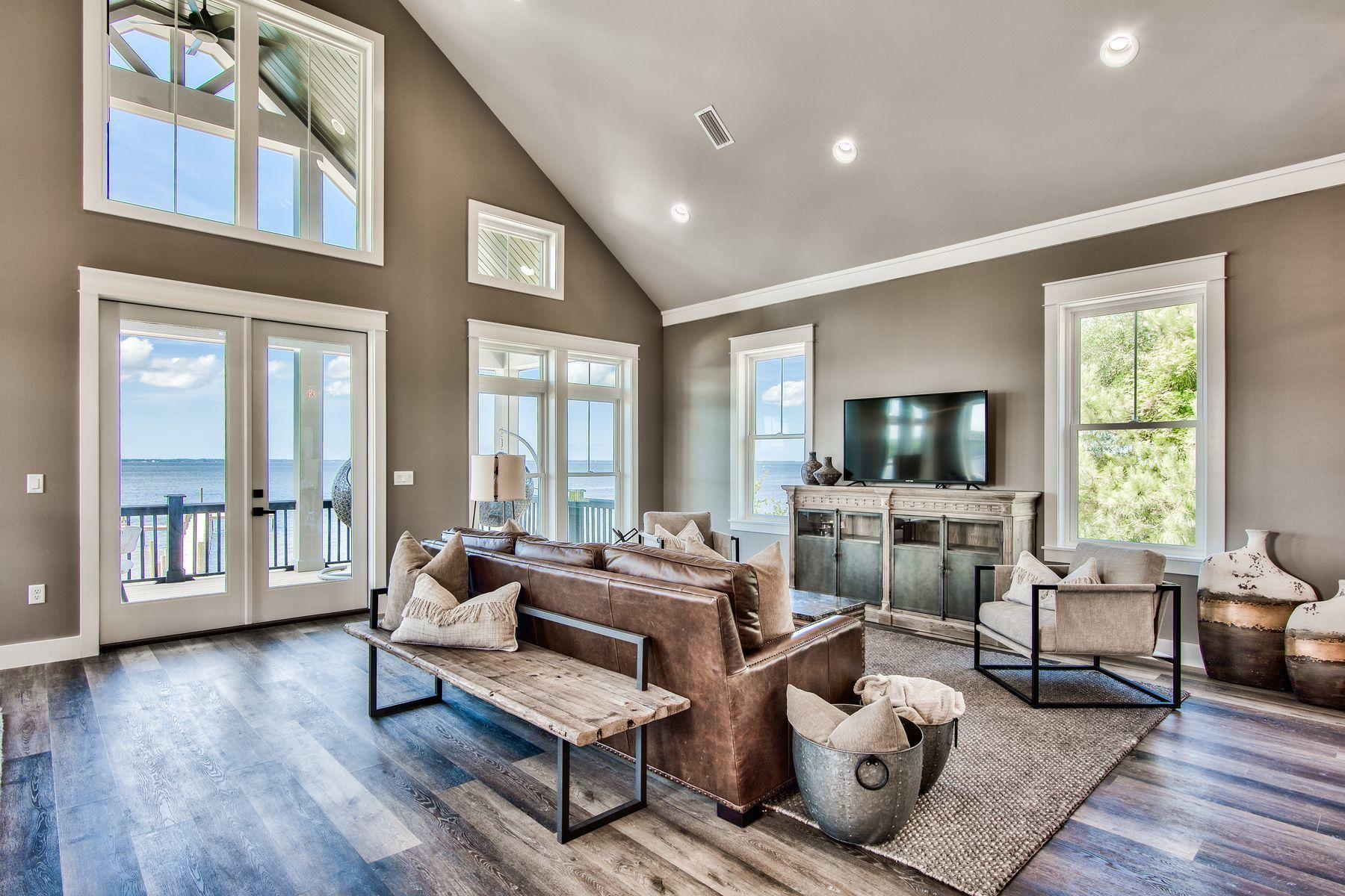474 Beatrice Point Road Freeport, FL 32439 - Photo 10 of 69 a living room with furniture and a flat screen tv