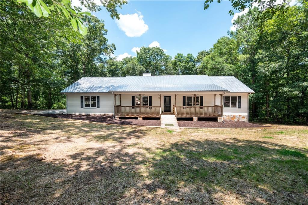 4769 Ridgewood Road Monroe, GA 30656 - Photo 1 of 1 a front view of a house with a yard