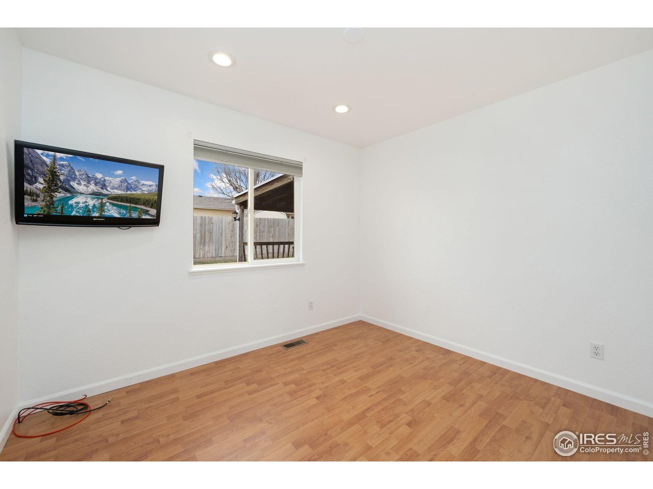 4616 Homestead Court Greeley, CO 80634 - Photo 14 of 22 a view of empty room with wooden floor