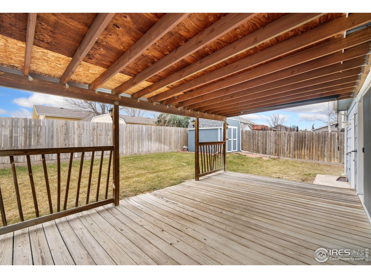 4616 Homestead Court Greeley, CO 80634 - Photo 18 of 22 a view of backyard with wooden floor