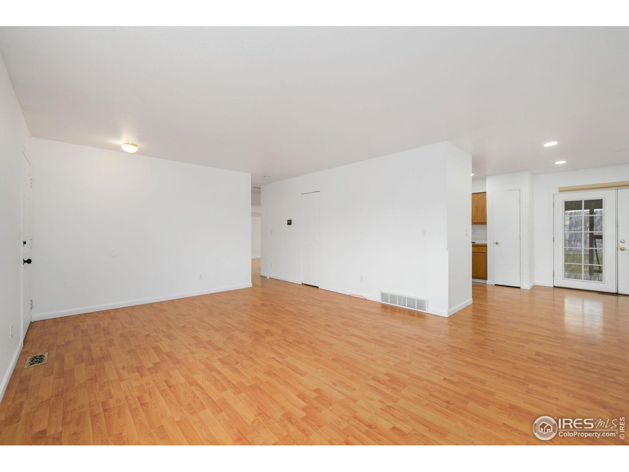 4616 Homestead Court Greeley, CO 80634 - Photo 5 of 22 a view of empty room with wooden floor