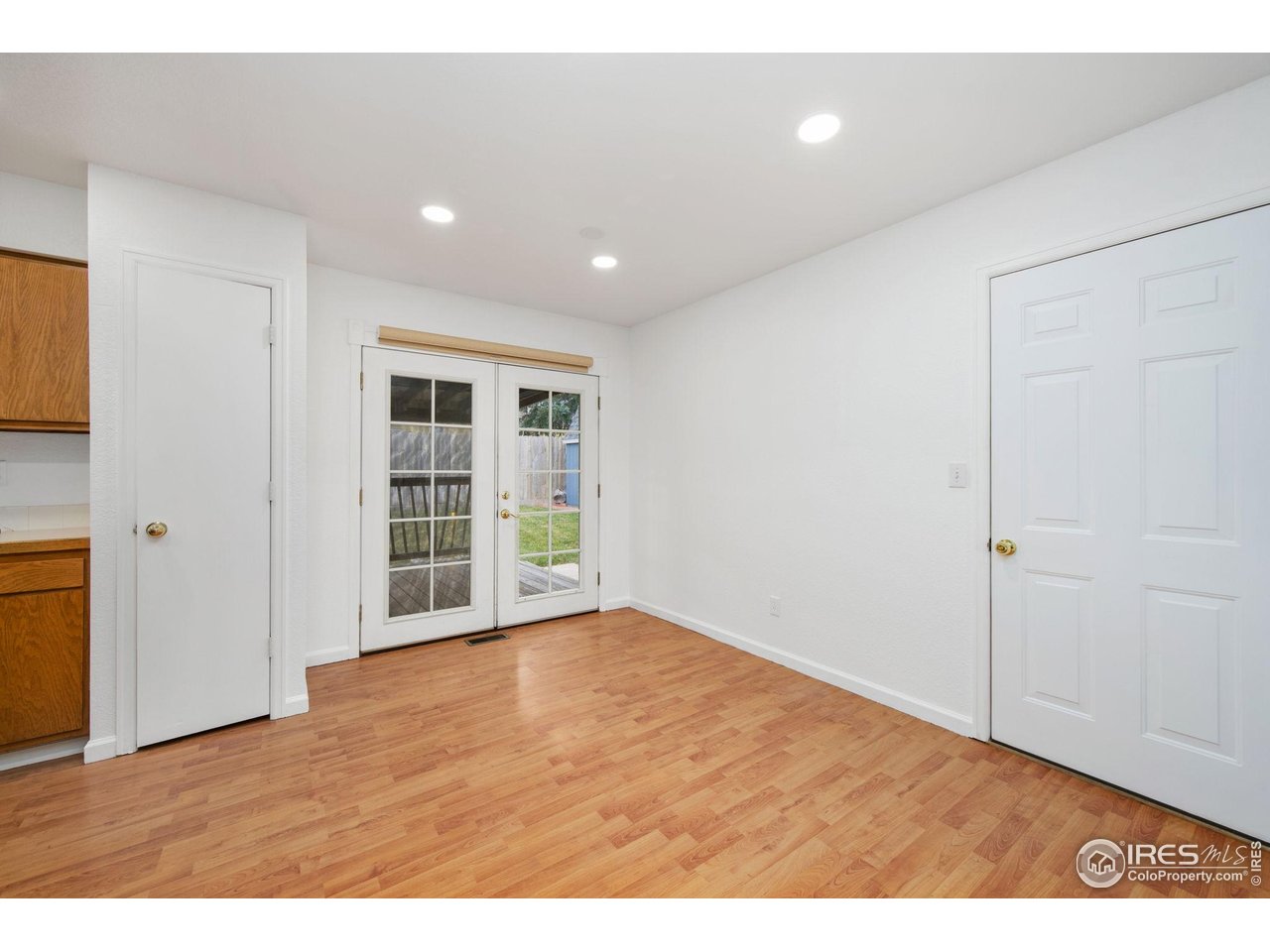 4616 Homestead Court Greeley, CO 80634 - Photo 6 of 22 a view of an empty room with wooden floor and closet