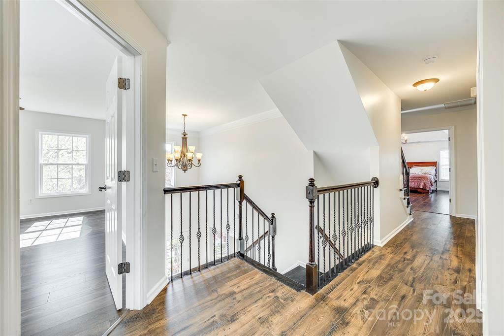 4005 Sedgewick Road Indian Trail, NC 28079 - Photo 14 of 38 a view of a hallway with wooden floor and windows