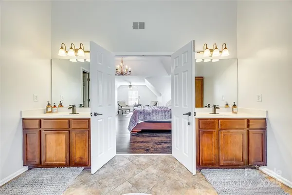 a en suite bathroom with a sink and a mirror