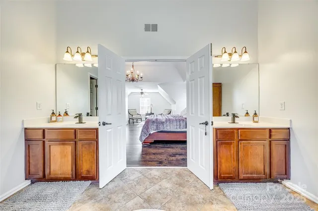 a en suite bathroom with a sink and a mirror