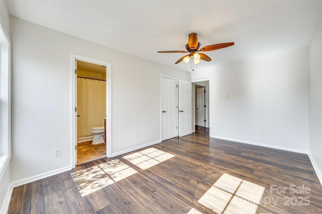 4005 Sedgewick Road Indian Trail, NC 28079 - Photo 25 of 38 a view of a room with wooden floor and a ceiling fan
