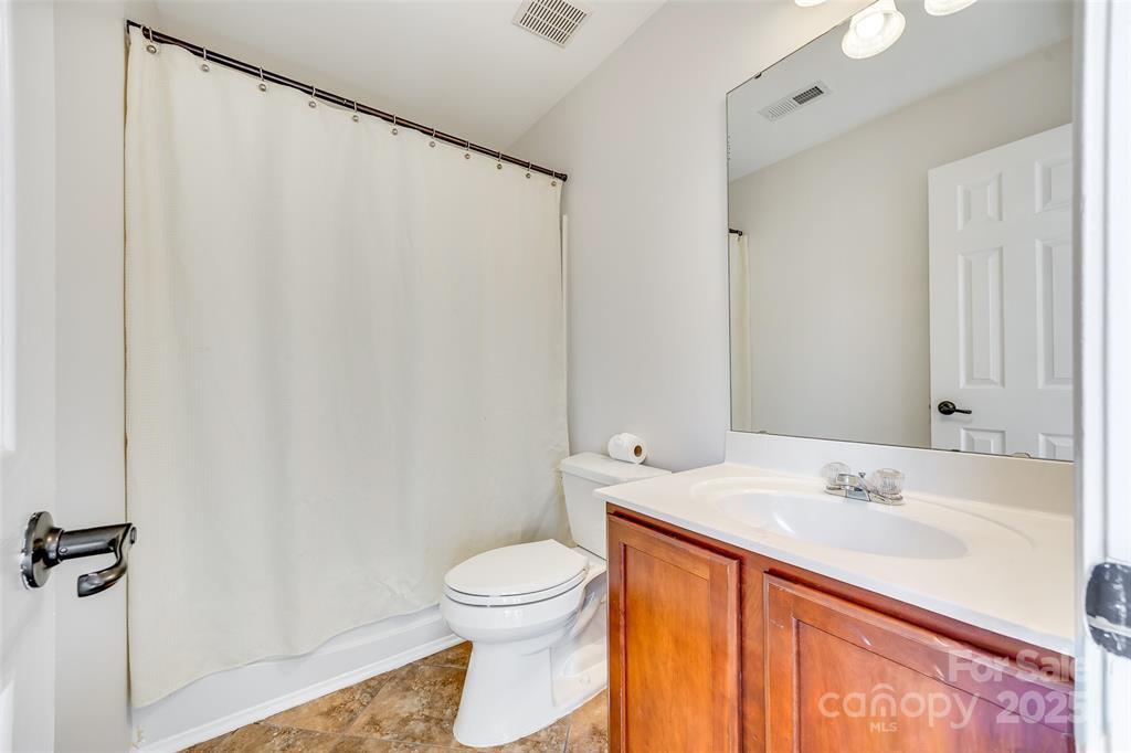 4005 Sedgewick Road Indian Trail, NC 28079 - Photo 26 of 38 a bathroom with a sink a toilet and a mirror