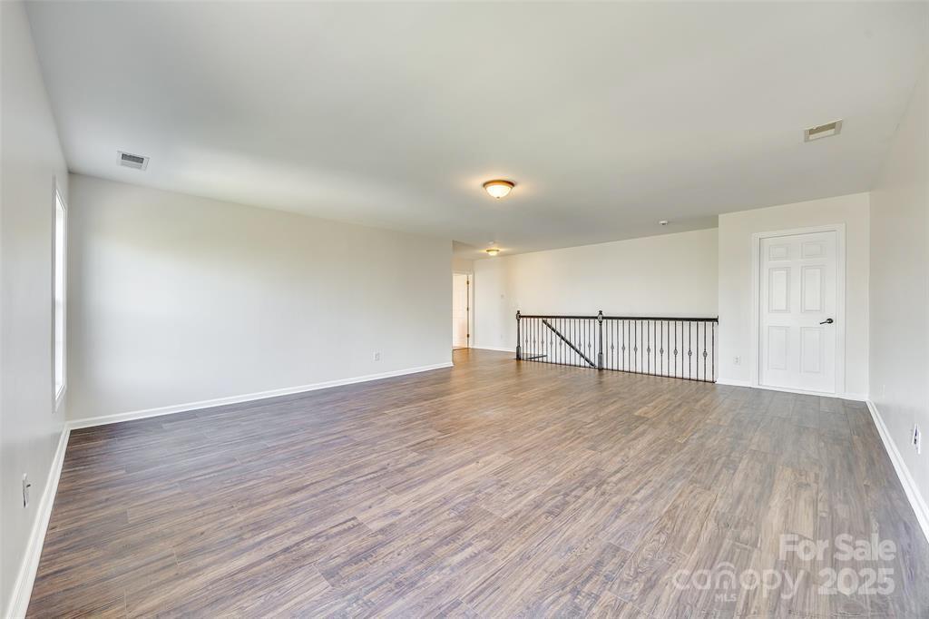 4005 Sedgewick Road Indian Trail, NC 28079 - Photo 29 of 38 a view of empty room with wooden floor