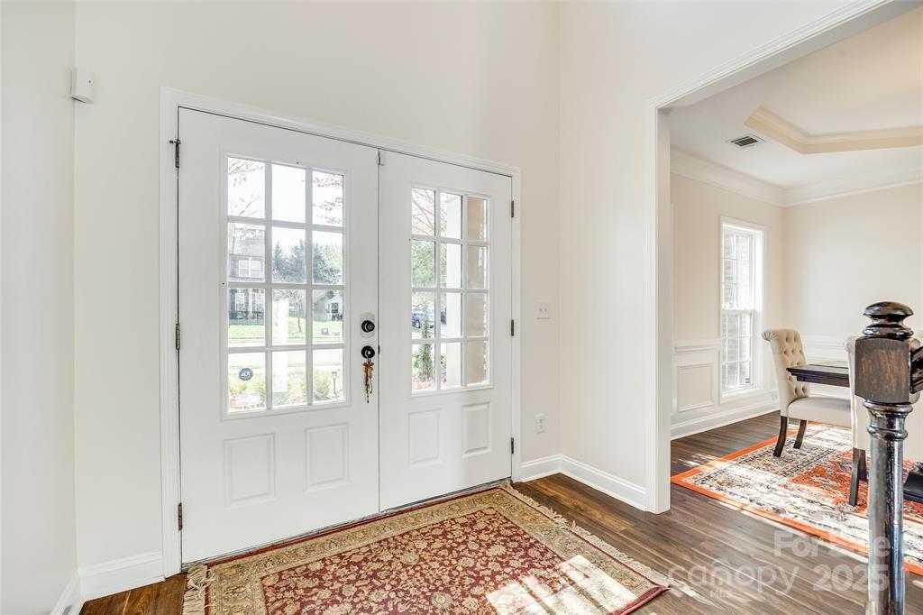 4005 Sedgewick Road Indian Trail, NC 28079 - Photo 3 of 38 a view of an empty room with a window and wooden floor