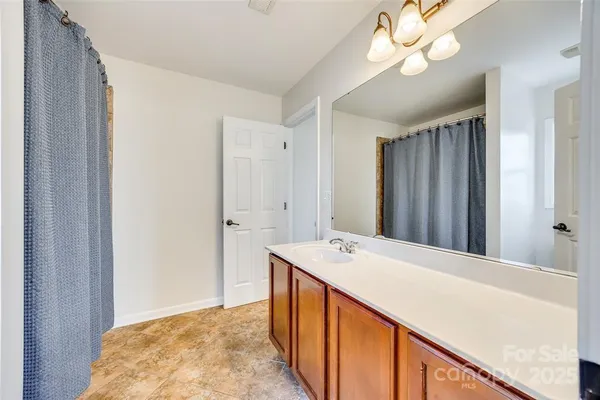 a view of a kitchen from a hallway