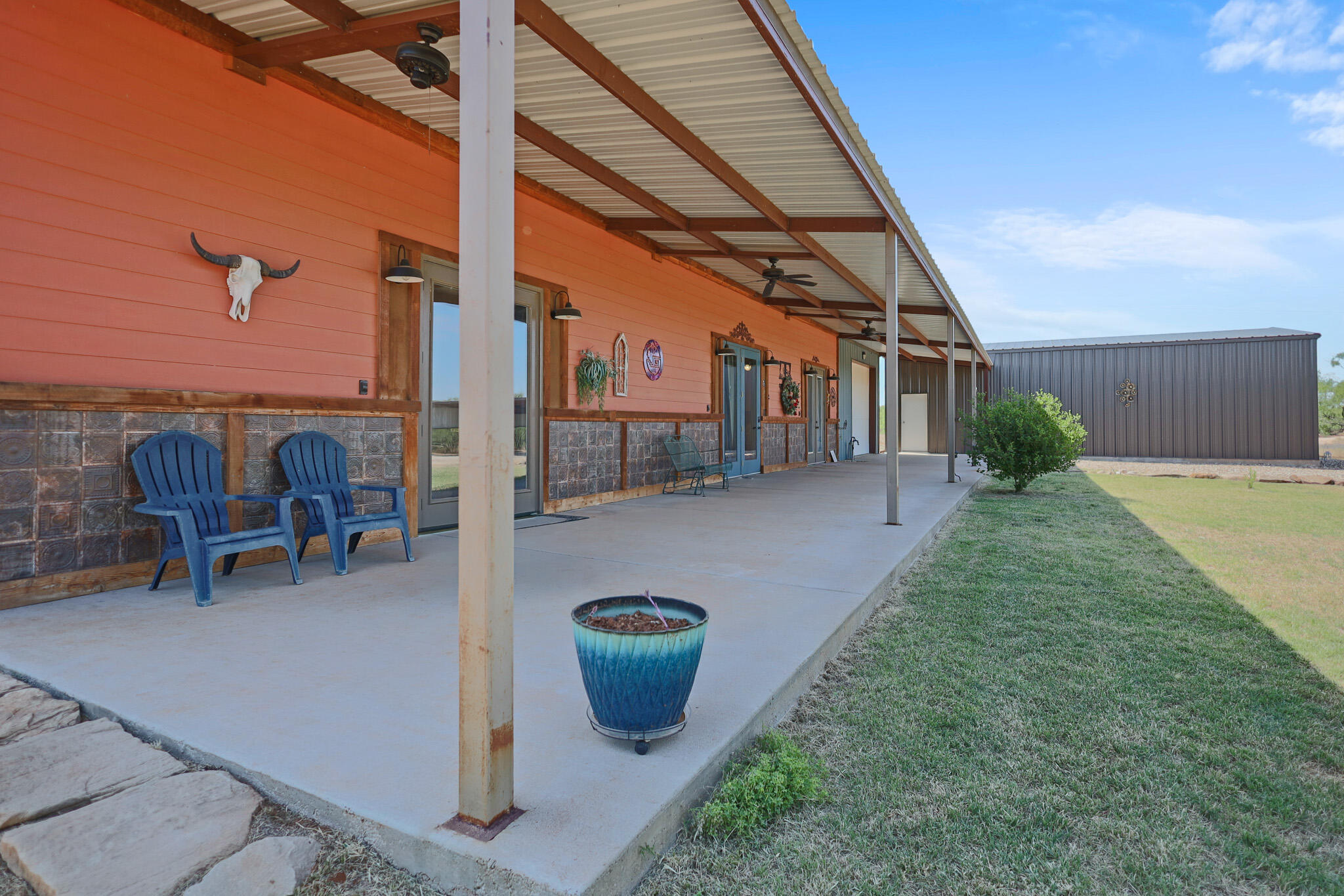 301 Fagan Road Snyder, TX 79549 - Photo 19 of 102 a view of a patio with a table and chairs