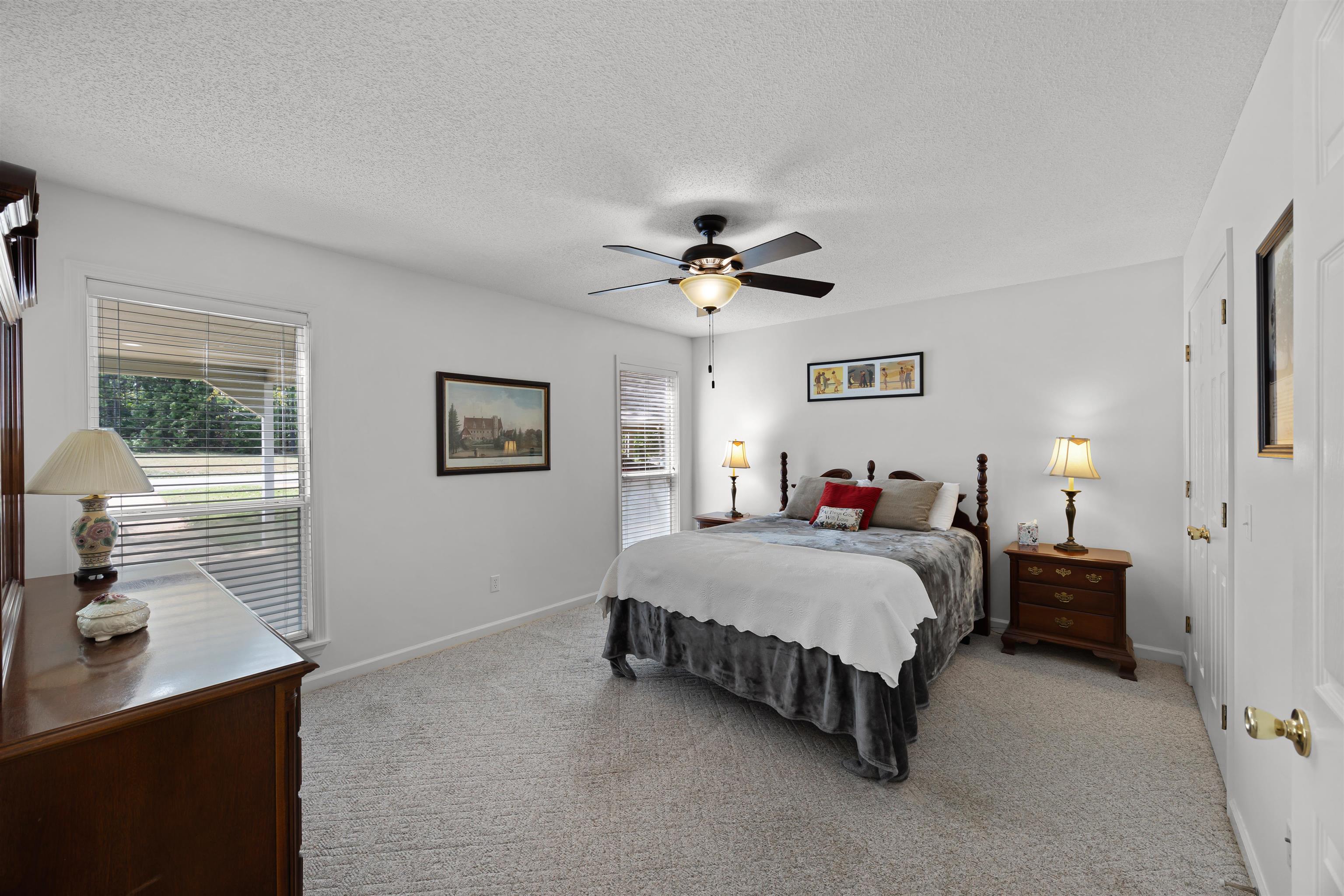 180 Vantage Pointe Counce, TN 38326 - Photo 12 of 30 a spacious bedroom with a bed and a table in it