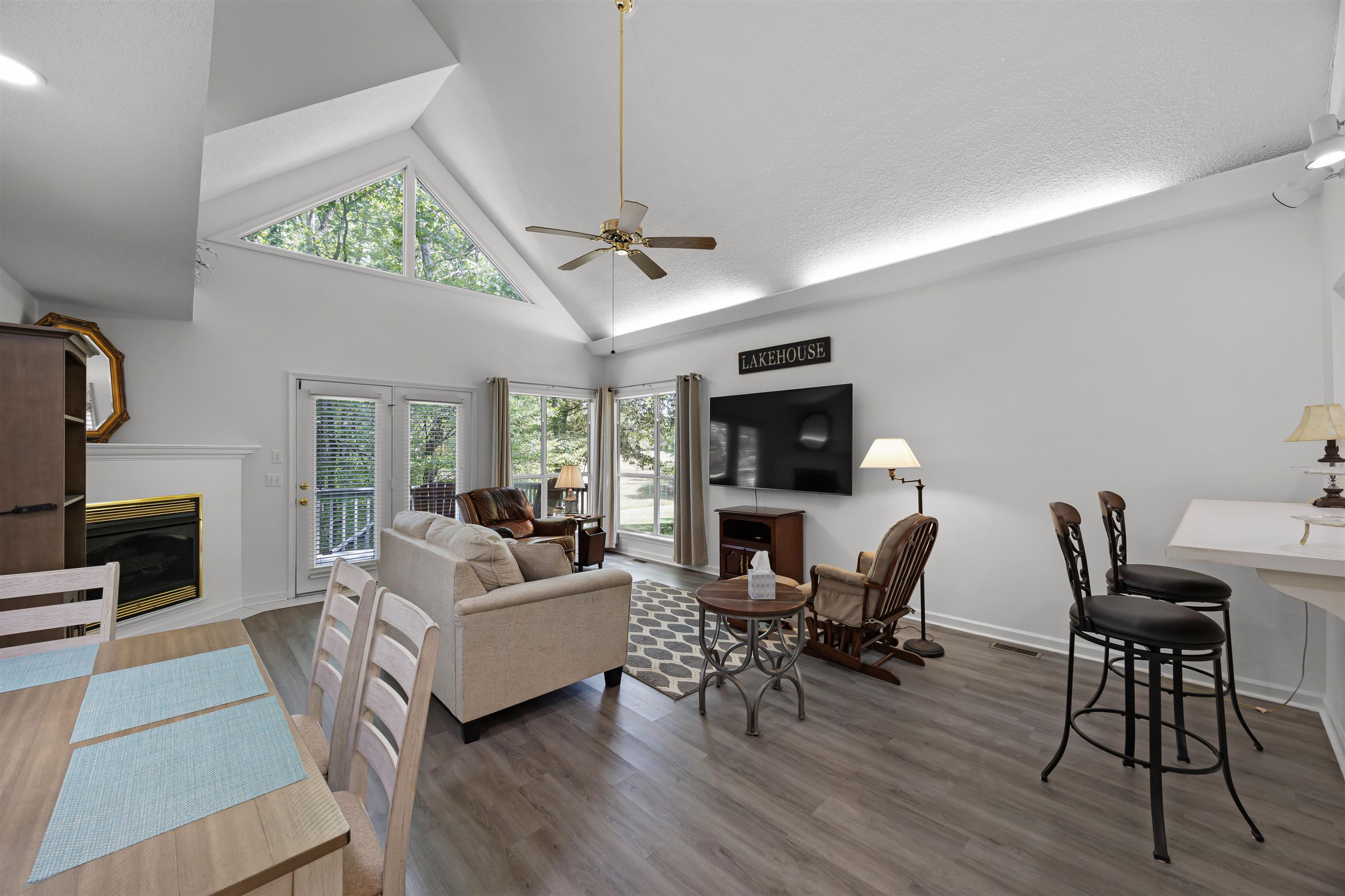 180 Vantage Pointe Counce, TN 38326 - Photo 6 of 30 a living room with furniture a fireplace and a flat screen tv