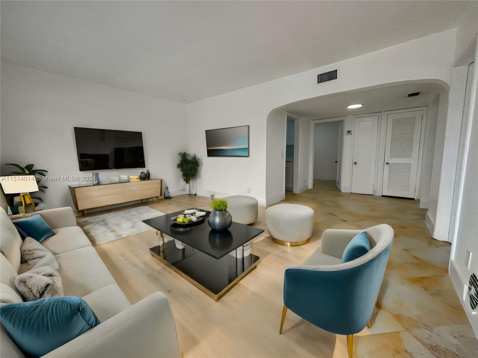 a living room with furniture and a flat screen tv