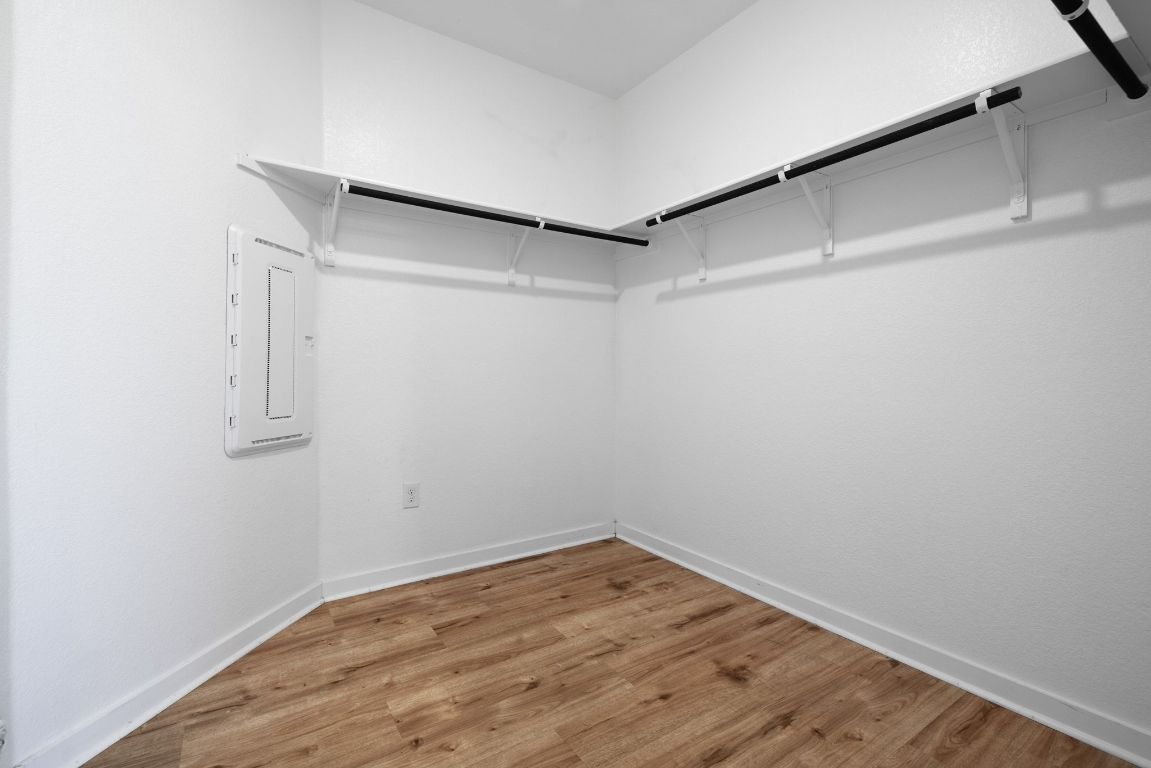 1120 Bear Track Loop Georgetown, TX 78628 - Photo 16 of 26 Walk in closet with light wood finished floors and electric panel