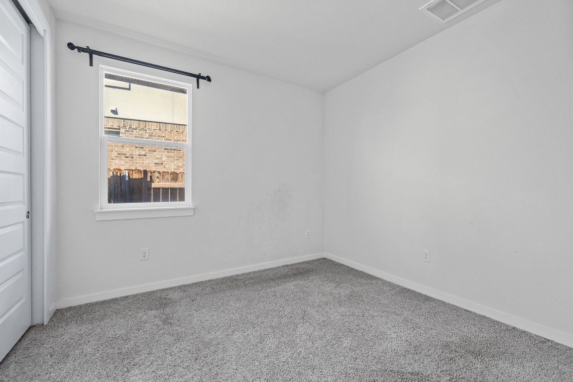 1120 Bear Track Loop Georgetown, TX 78628 - Photo 17 of 26 Unfurnished room featuring carpet flooring and baseboards
