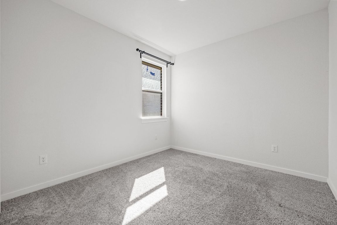 1120 Bear Track Loop Georgetown, TX 78628 - Photo 19 of 26 Carpeted spare room with baseboards