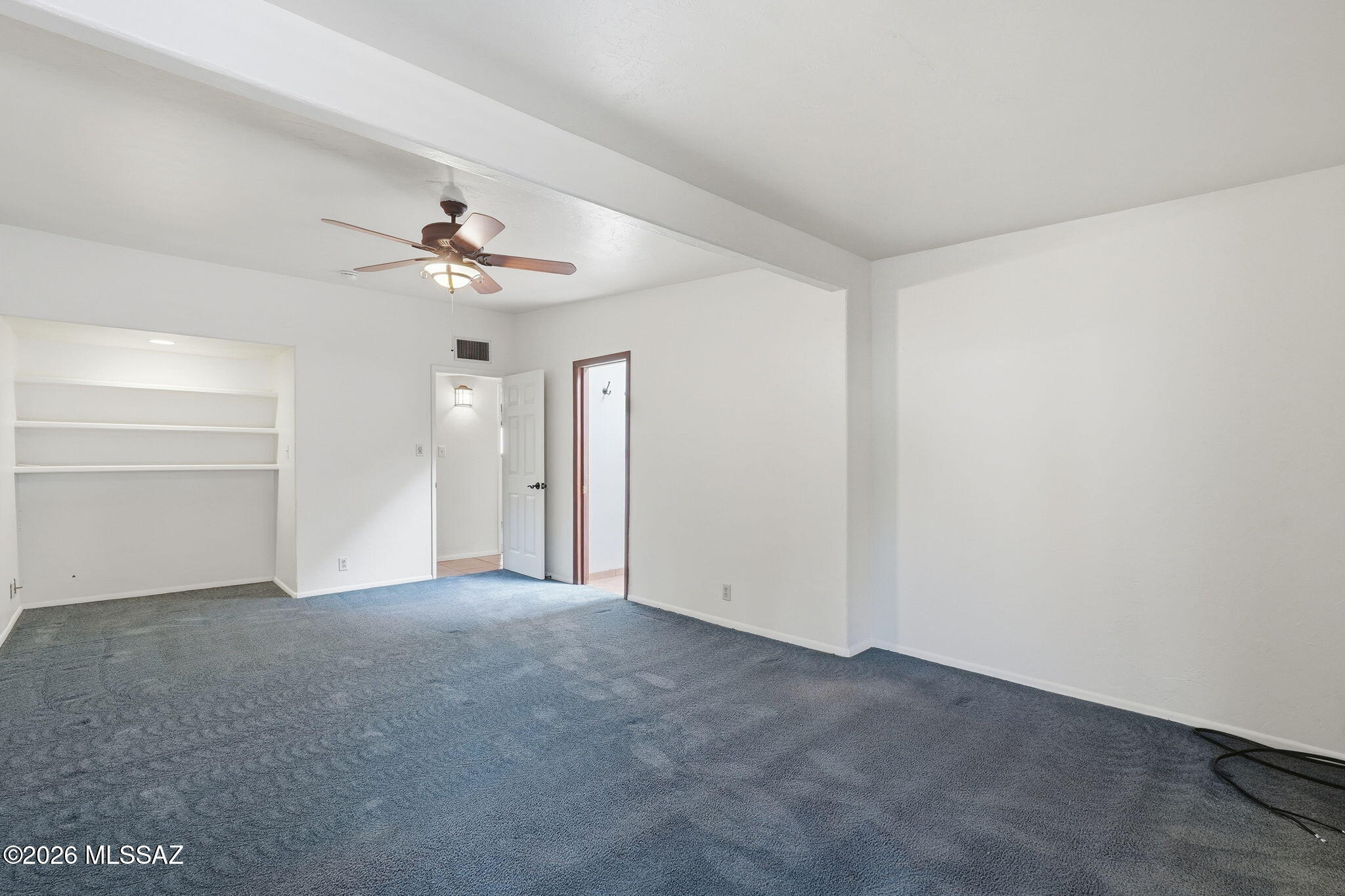 1125 East Kleindale Road Tucson, AZ 85719 - Photo 17 of 49 a view of an empty room with a ceiling fan