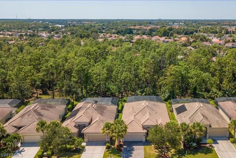 an aerial view of a house with lots of trees