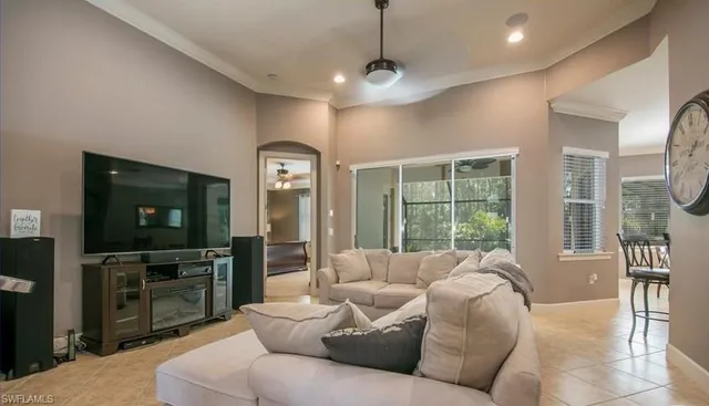a view of a dining room with furniture a chandelier and wooden floor